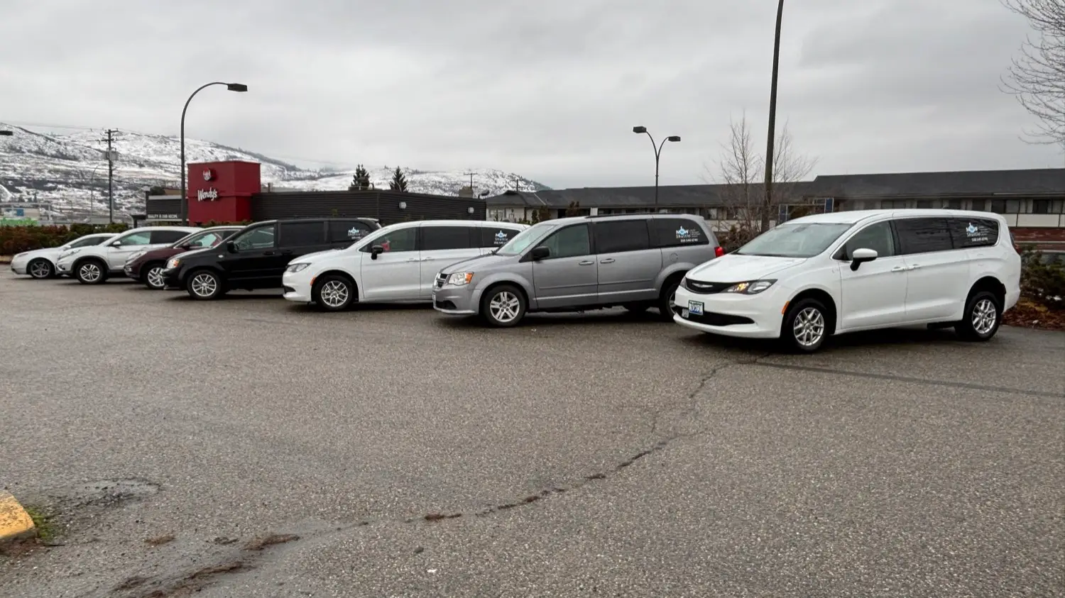 The NOW Shuttle fleet lined up outside the Vernon base