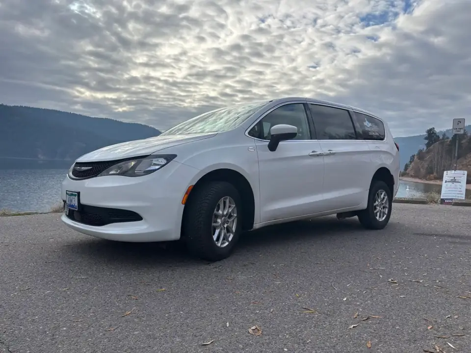 NOW Shuttle accessible minivan parked beside Okanagan Lake